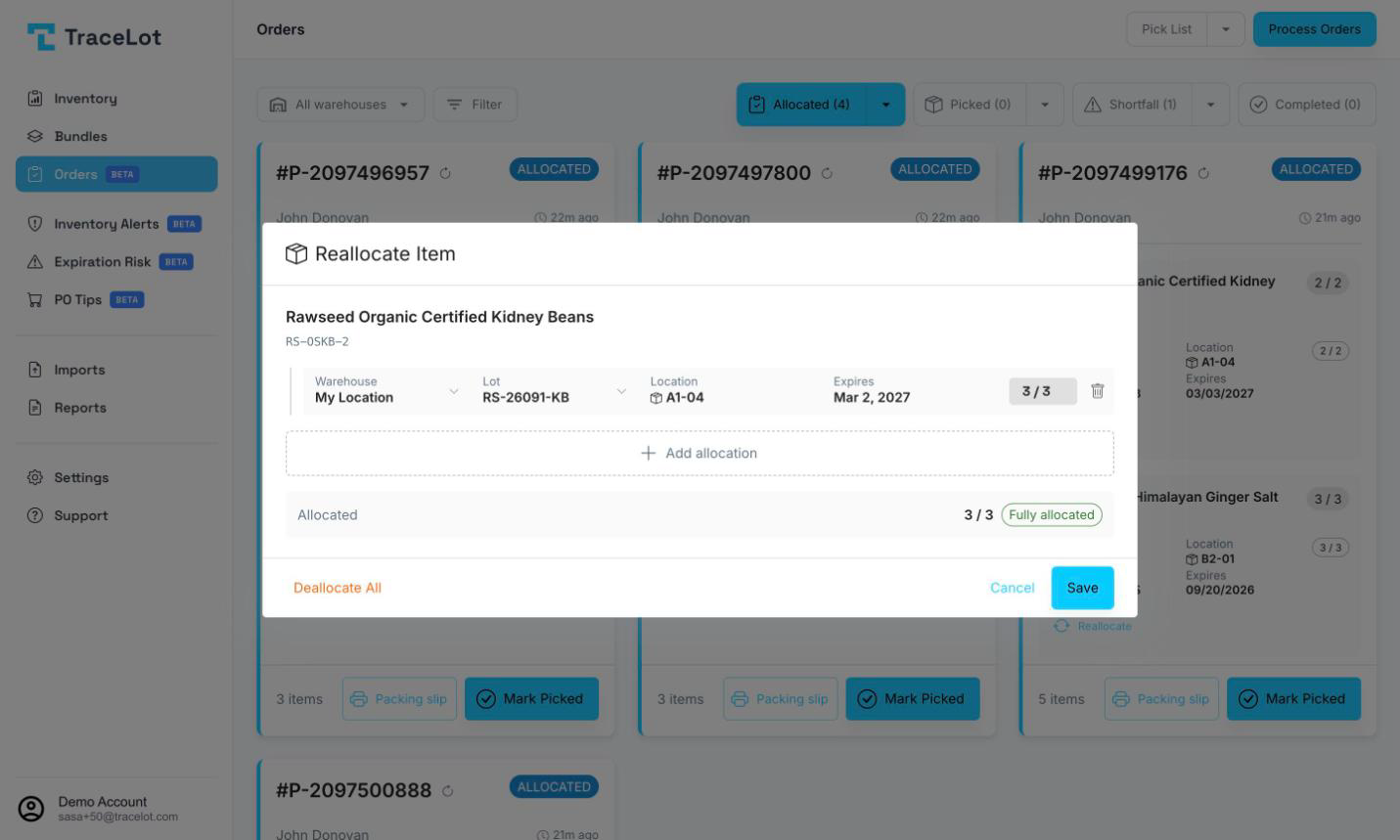 The Reallocate Item dialog showing warehouse, lot, location, expiry, and quantity for each allocation row